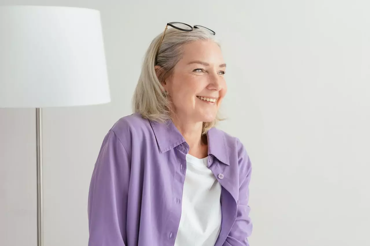 A smiling woman with dentures